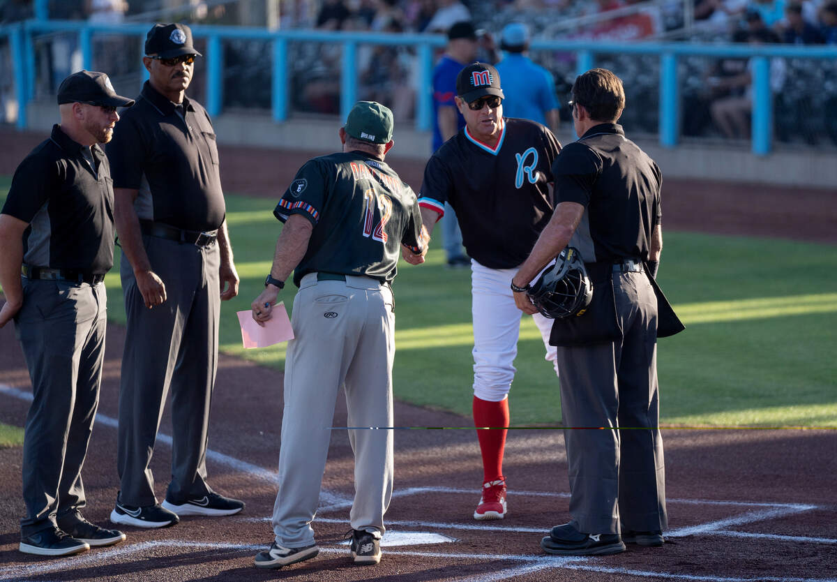 Modesto Roadsters manager JT Snow greets Oakland Ballers manager Aaron Miles before a Pioneer Baseball League game at Modern Woodmen Field in Modesto on Friday, July 3, 2026.